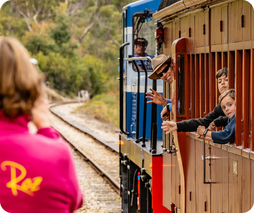Family waving from train